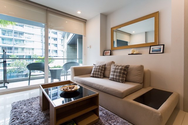 Condominium for sale Pattaya showing the living area and balcony Condominium for sale Pattaya showing the living area and balcony