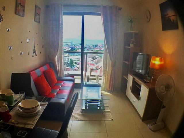 Condominium for sale UNIXX South Pattaya showing the living room and balcony Condominium for sale UNIXX South Pattaya showing the living room and balcony